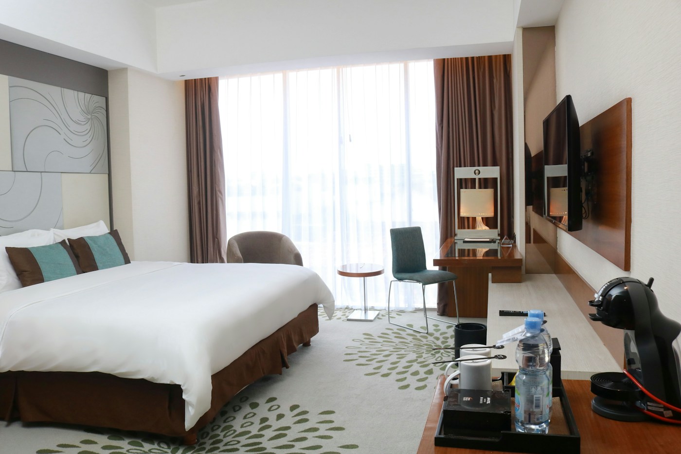 Stylish hotel bedroom with a large bed
